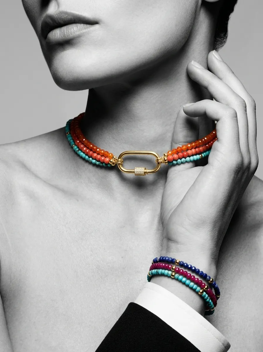 Orange and coral strands worn as a choker with a gold carabiner
